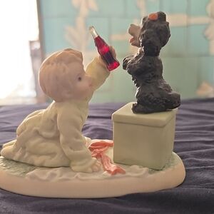 Child and Dog Figurine with Red Bottle